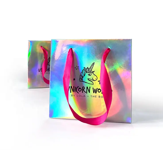 Custom Logo Luxury Glossy Pink Ribbon Handle Paper Bag Gift Craft Jewelry Cosmetic Packaging Holographic Paper Shopping Подержка с розовой лентой