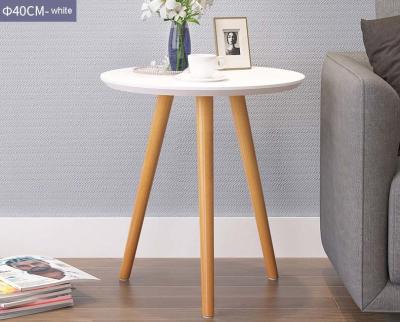 One Round And Square Shape Beside Center Coffee Table Near Sofa Inside Room