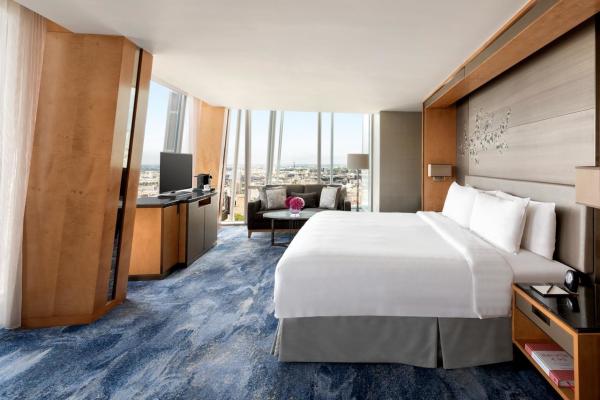 Star Hotel Room Furniture Upholstered bed with Sofa chairs and Fixed wood Panels in Wall Wardrobe cabinets