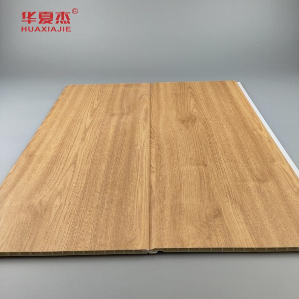 Panneaux muraux en PVC à grains de bois en gros Panneau de plafond en PVC anti rayures pour la décoration résidentielle