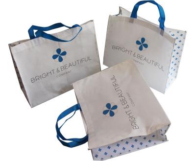 White and Blue 85gsm Nonwoven Fabric Carrier Bags With Matt Coated,White Piping,Button,Blue Handle Resable & Durable Bag