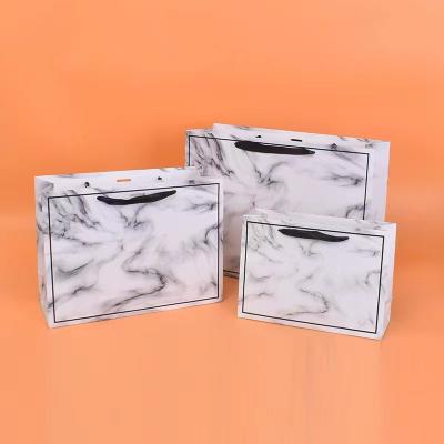 20*28cm 26*35cm 32*43cm Cosmetic Paper Bags With Ribbon Handles