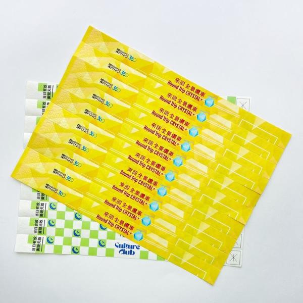 Vente en gros d'événements jetables Tyvek Bracelets d'impression de logo coloré Bracelets en papier étanche