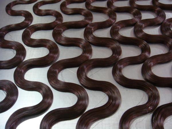 La bande ondulée dans les extensions de cheveux 5 grammes - 8 grammes