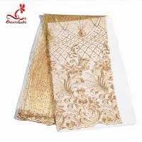 O ouro da flor dos vestidos de nivelamento bordou tela frisada