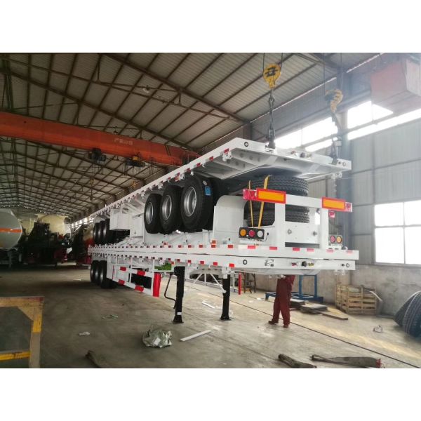 Customizable Flat Bed Semi Trailer with 40-60t Load Capacity, High-strength Steel Construction, and 3 Axles for Heavy-Duty Transport