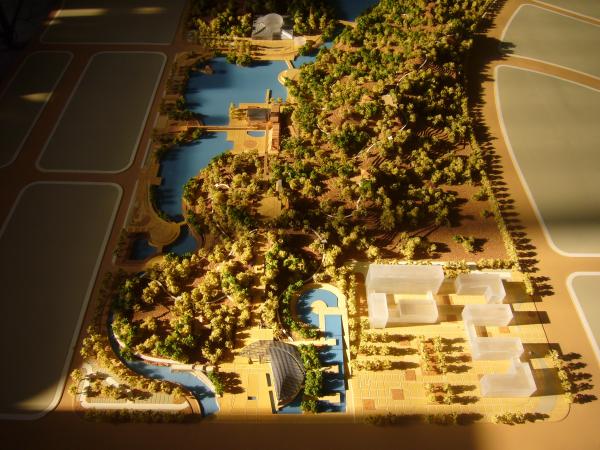Architectural Model of Modern Urban Masterplan with High-Density Buildings, Roads, Waterways, and Greenbelts