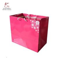 Sacos de papel cor-de-rosa amigáveis de Eco com os punhos para a roupa