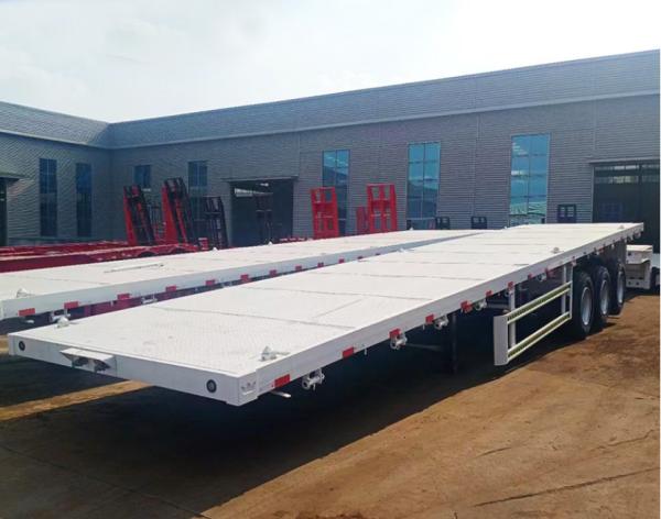 Truck Trailer Flatbed Semi Trailer With 30-60 Tons Loading Capacity And 1 Tool Box Big Chamber