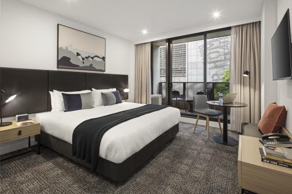 Budget hotel bedroom furniture of PU leather upholstery bed and Laminate desk with TV cabinets