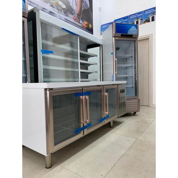 Stainless steel commercial refrigerator workbench in the back kitchen of hotel restaurant