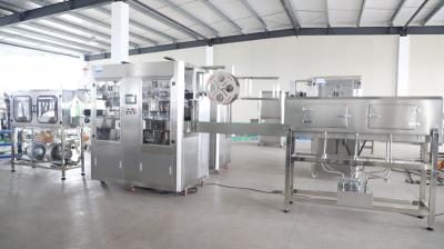 As cabeças dobro encolhem a máquina de etiquetas da luva