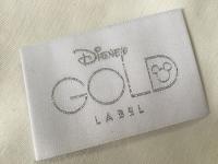 A roupa tecida dobra da extremidade de Bage do ouro de Disney etiqueta o corte frio/corte do calor