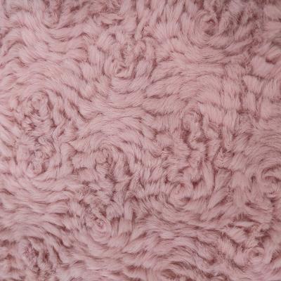 A tela cor-de-rosa da pele do falso do poliéster fez malha 58/60 para o coelho da flor da roupa