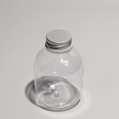 Garrafas PET transparentes com parafusos em tampas de alumínio