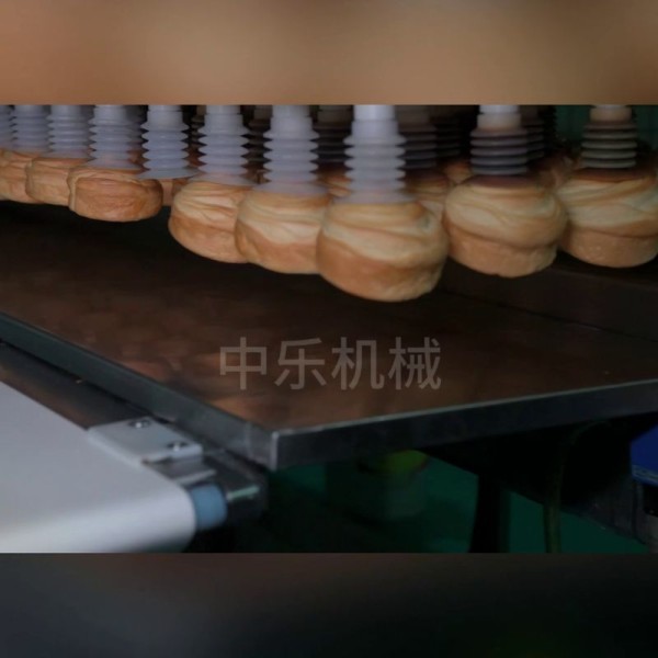 Automated Round Raisin Swirl Bread Production Line: Lamination, Servo Cutting & Precision Tray Panning