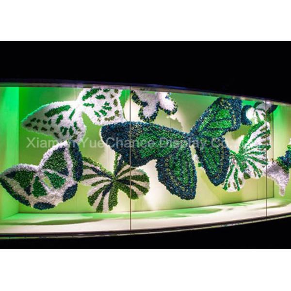 Le papillon décoratif de tissu fait à partir de la fausse fleur a adapté des d