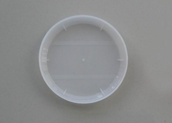 White convex shape plastic PE caps with spoon inserted for porridge tin can