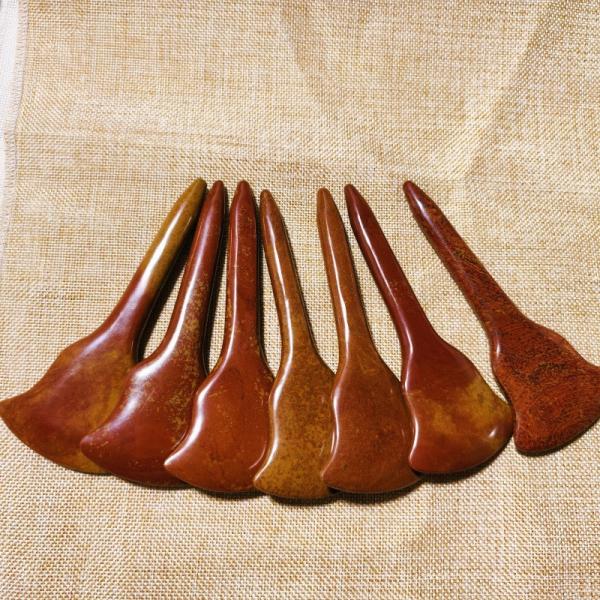 Experience the Healing Benefits of Full-body Massage and Acupoint Stimulation with Red Bian Stone Gua Sha Board