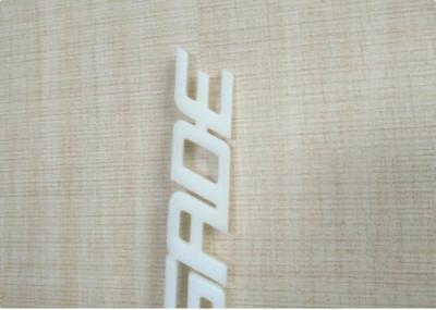 White / Ivory Automotive Plastic Injection Molding Custom Vehicle Logos Sub Gate Type