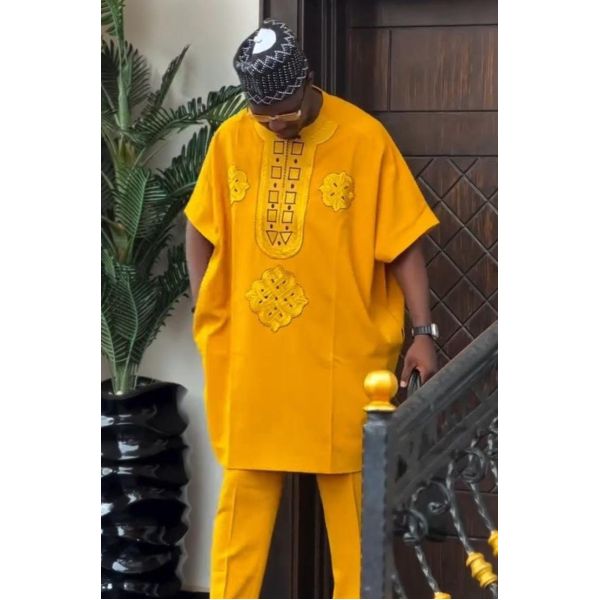 Authentic African Kente Cloth Outfit with Vibrant Patterns, Breathable Fabric, and Cultural Symbolism