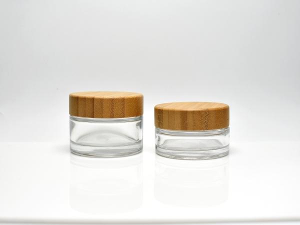 Sustainable classic 1OZ 1.7OZ Clear or Frosted Glass Cosmetic Jar With Real Bamboo Cap Lid for skincare Face Cream