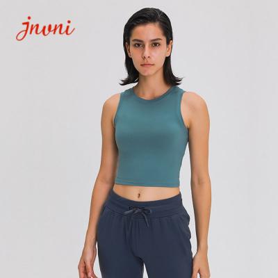 Les femmes élevées autour des soutiens-gorge de sports de yoga de cou soulèvent le dessus de réservoir antichoc de culture