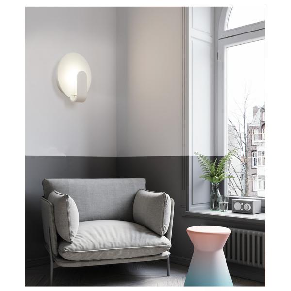 Modern simple and creative bedroom bedroom iron art wall lamp.
