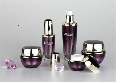 Transparent And Purple Empty Makeup Bottles With A Metallic Color