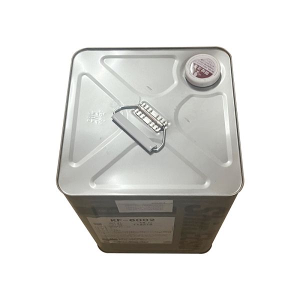 Fluido de silicona Shin-Etsu KF-6002 con viscosidad de 75 mm²/s, densidad relativa de 0.98 y punto de inflamación de 165°C para aplicaciones industriales y cosméticas