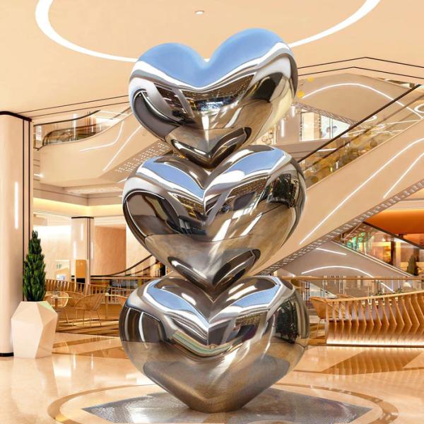 Décoration d'hôtel Finition miroir cœur empilé sculpture en acier inoxydable