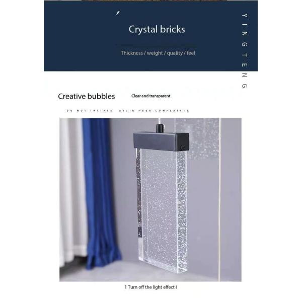 Éclairage de l'escalier du hall d'hôtel Aluminium et lampe suspendue en cristal pour un design moderne