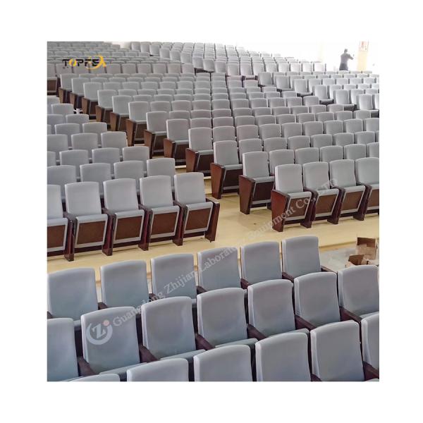 Cadeira de auditório de cinema preto com apoio de braço e construção pesada