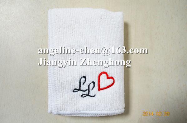 Microfiber white face towel with small embroidery logo