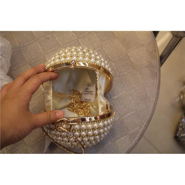 Round high-grade pearls evening bags woman holding a high-end fashion evening bag bride