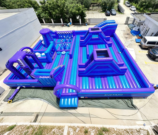 Purple Inflatable Ninja Obstacle Course with Climbing Challenges Balance Steps and Multiple Activity Zones