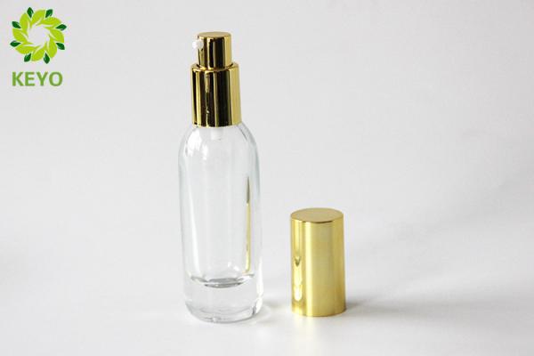 Clear Glass Foundation Bottle 30ml Thick Bottom Type With Gold Aluminium Pump