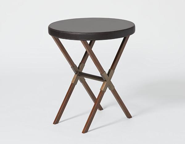 Antique brushed bronze metal base with upholstered leather top round hotel guestroom side table