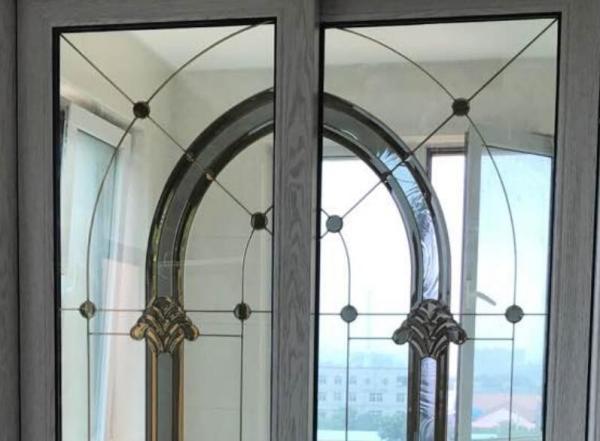 Decorative leaded glass with brass came in sliding doors