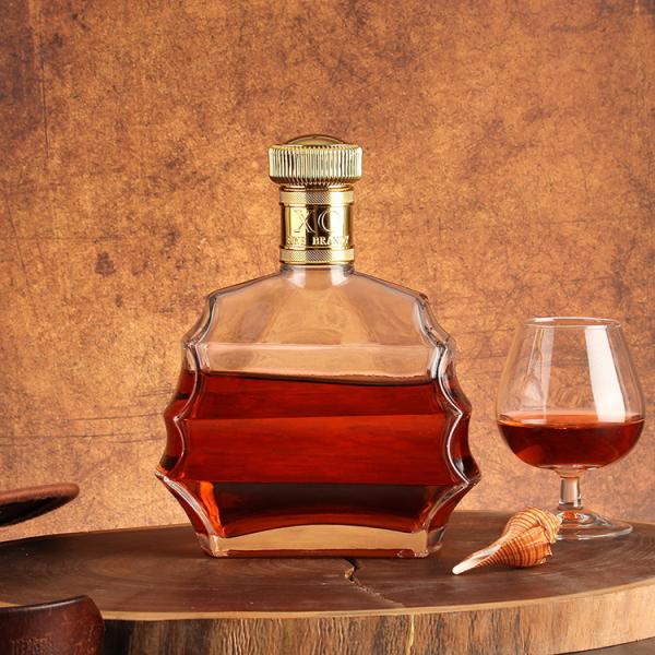 Estampagem a quente, manuseio da superfície, pescoço curto, garrafa de tequila de vidro para festas.