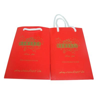La corde de papier sensible rouge professionnelle a manipulé le service d'impression de sac de transporteur pour l'achat
