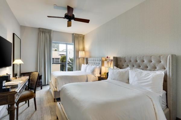 Kota Semarang hotel bedroom furniture fabric bed with metal racks and solid wood table desk