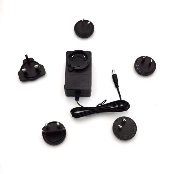 100%PC International Adapter with Interchangeable Plug 30W 36W AU US EU UK Stock 5V 9V 12V 24V 1.75A 3A Travel Adaptor DC