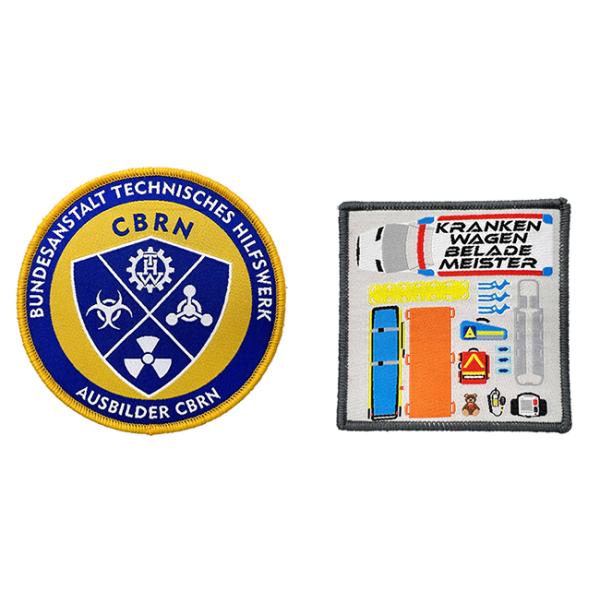 Изготовленный на заказ логотип команды шьет на вышитых заплатах взваливает на плечи Washable заплаты сплетенные одеждой