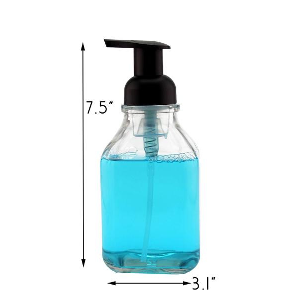 Прозрачный стеклянный пустой насос пены разливает прочную ровную поверхность по бутылкам