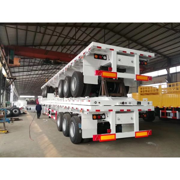 Customizable Flat Bed Semi Trailer with 40-60t Load Capacity, High-strength Steel Construction, and 3 Axles for Heavy-Duty Transport