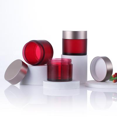 O creme cosmético pessoal range o recipiente vazio da garrafa do frasco do creme de cara