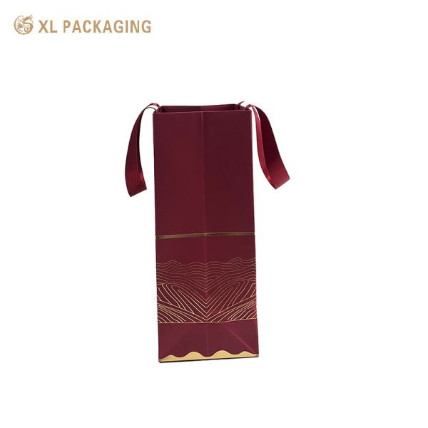 Premium Matte Burgundy Wine Paper Gift Bag with Oriental Gold Foil Stamping and Rivet Reinforced Satin Ribbon Handles