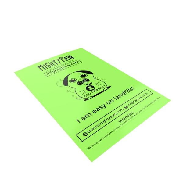 Papel - sacos Compostable isolados do desperdício do cão
