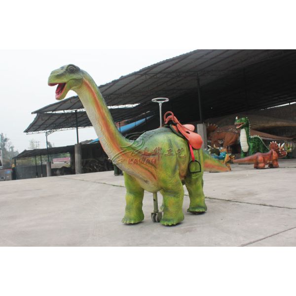 Электрический идя динозавр едет монетка эксплуатируемая для утверждения ИСО КЭ площади города